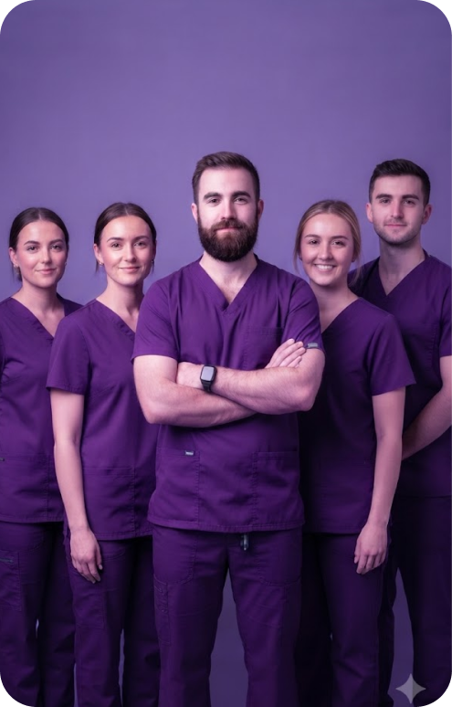 Dental team wearing purple scrubs